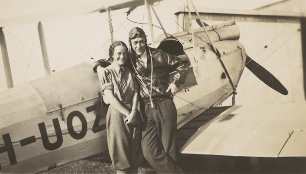 Nancy Bird and Jack Kingsford-Smith standing next to a de Havilland DH.60M Moth (VH-UOZ), Mascot [?], New South Wales, ca. 1933, 1 / E. A. Crome